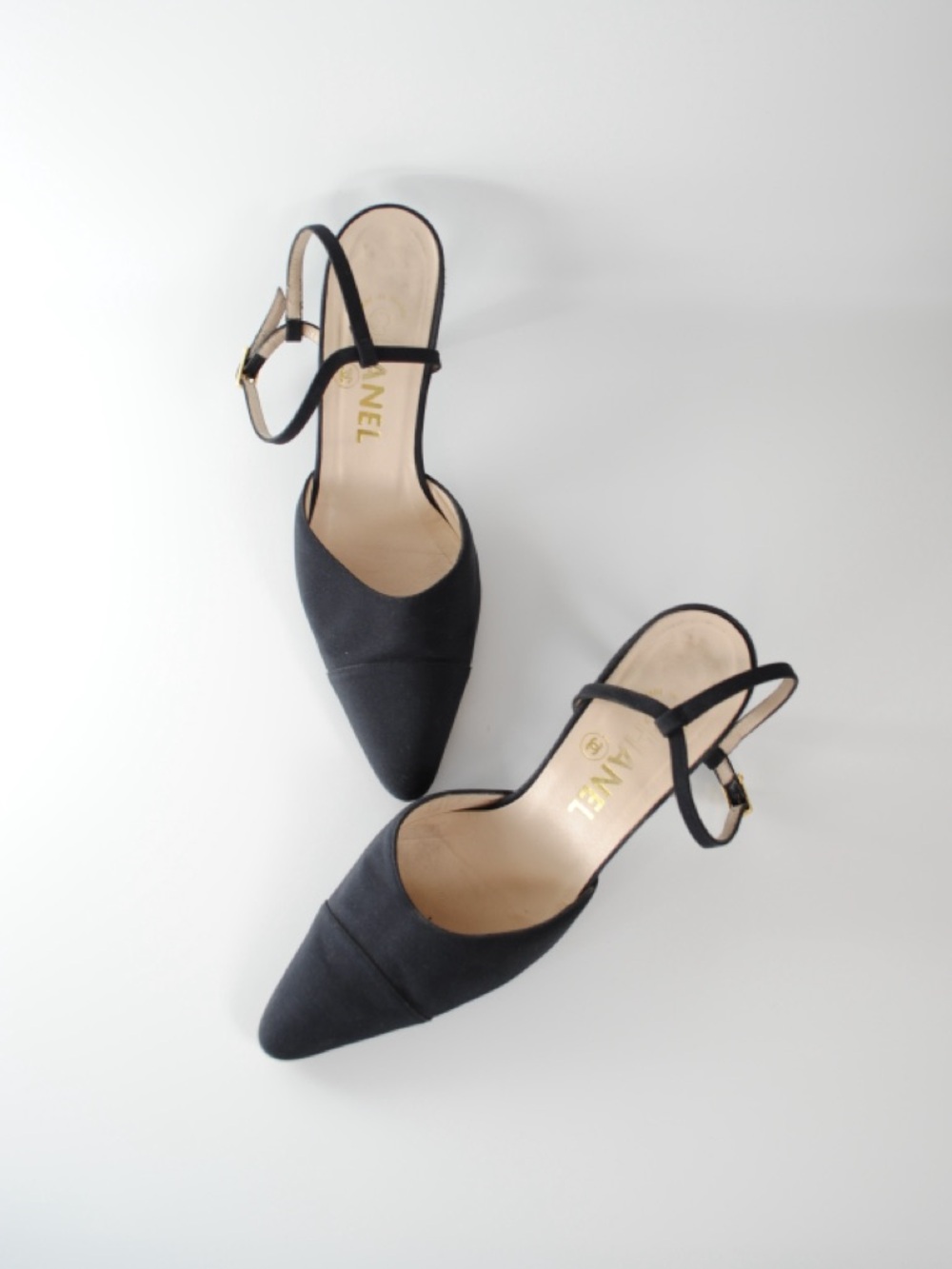 CHANEL Black Pointed Toe Slingback Heels with Gold Logo